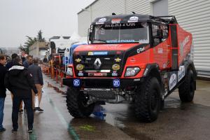 Three trucks getting ready to leave for the Dakar